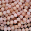Close-up of pink beads with slight variations in color.