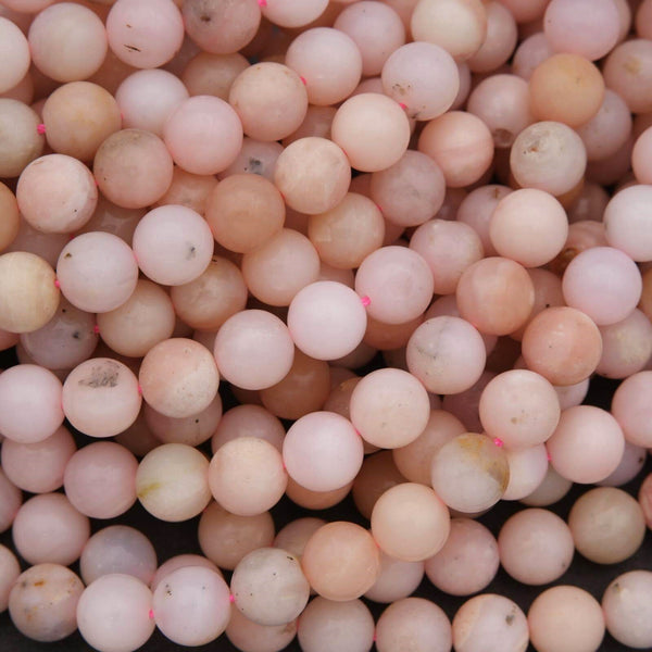 Close-up of pink beads with slight variations in color.