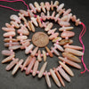 Pink opal stick shape beads.