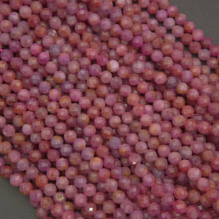 Natural pink ruby gemstone beads with delicate faceting, offering warm blush hues and organic color variation throughout.