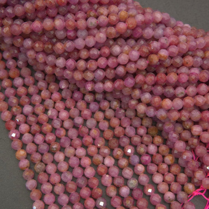 Softly faceted pink ruby beads with subtle translucency and mixed rosy coloration, ideal for elegant and understated jewelry designs.