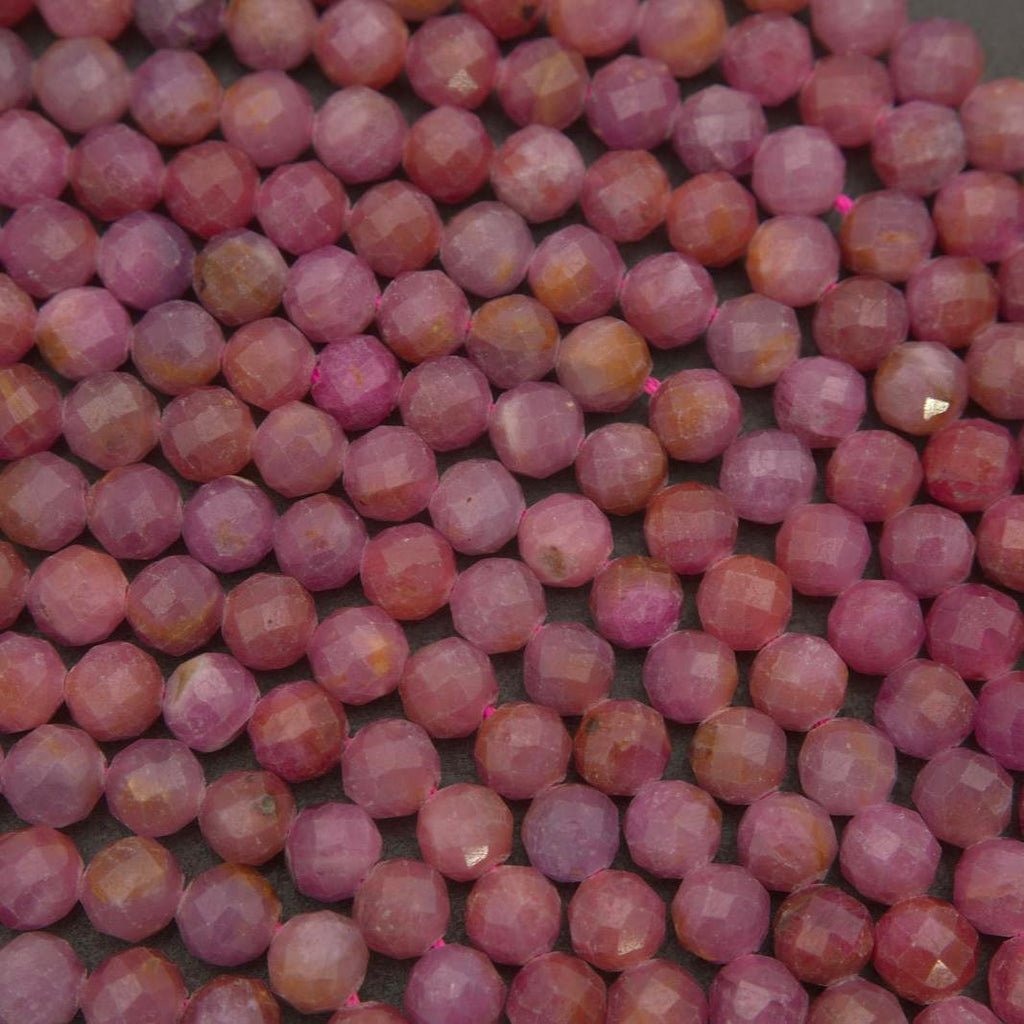Light pink ruby beads with fine faceting and tonal variation, creating a balanced blend of texture, color, and natural charm.