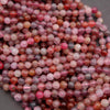 Close-up of multicolored round beads on a gray background