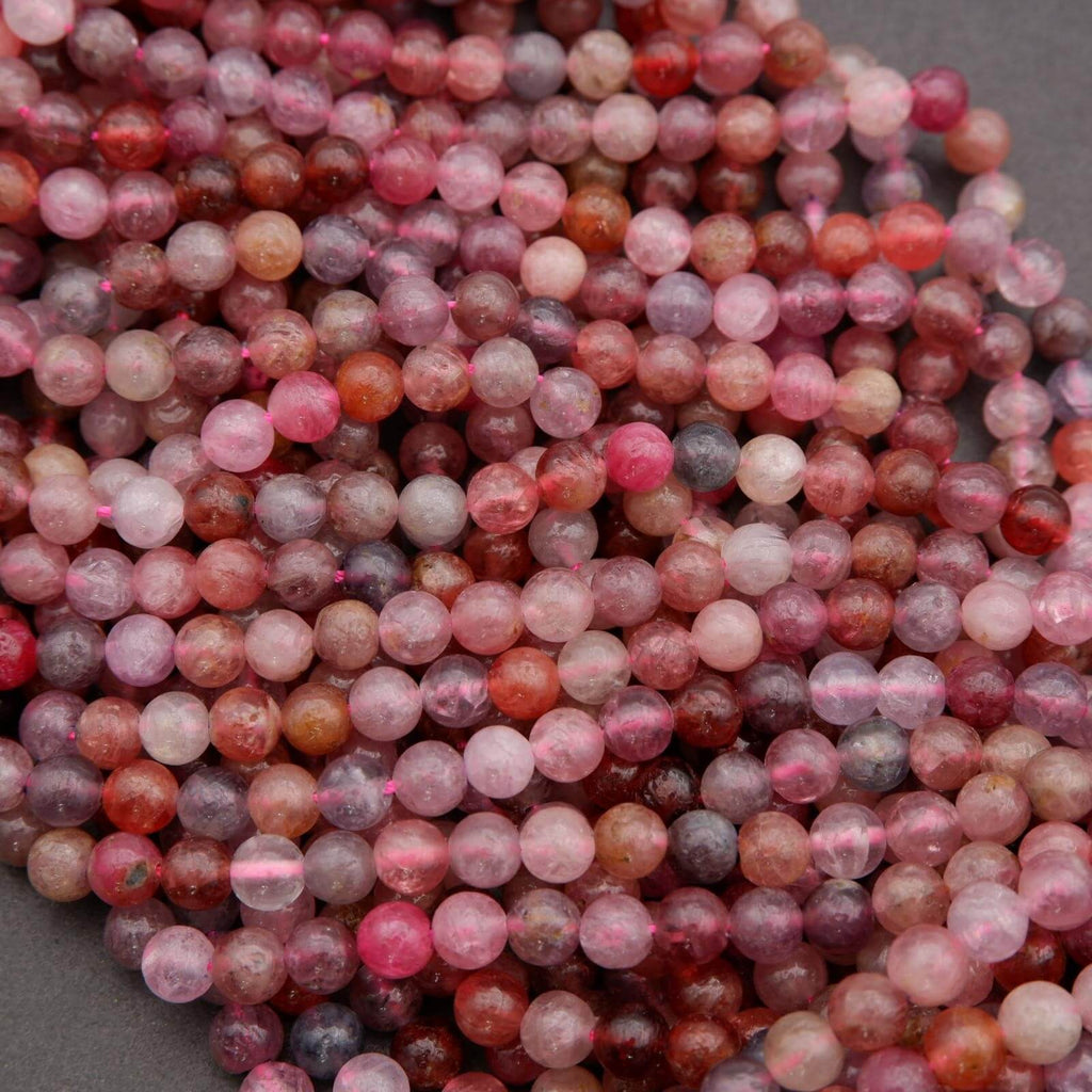 Close-up of multicolored round beads on a gray background