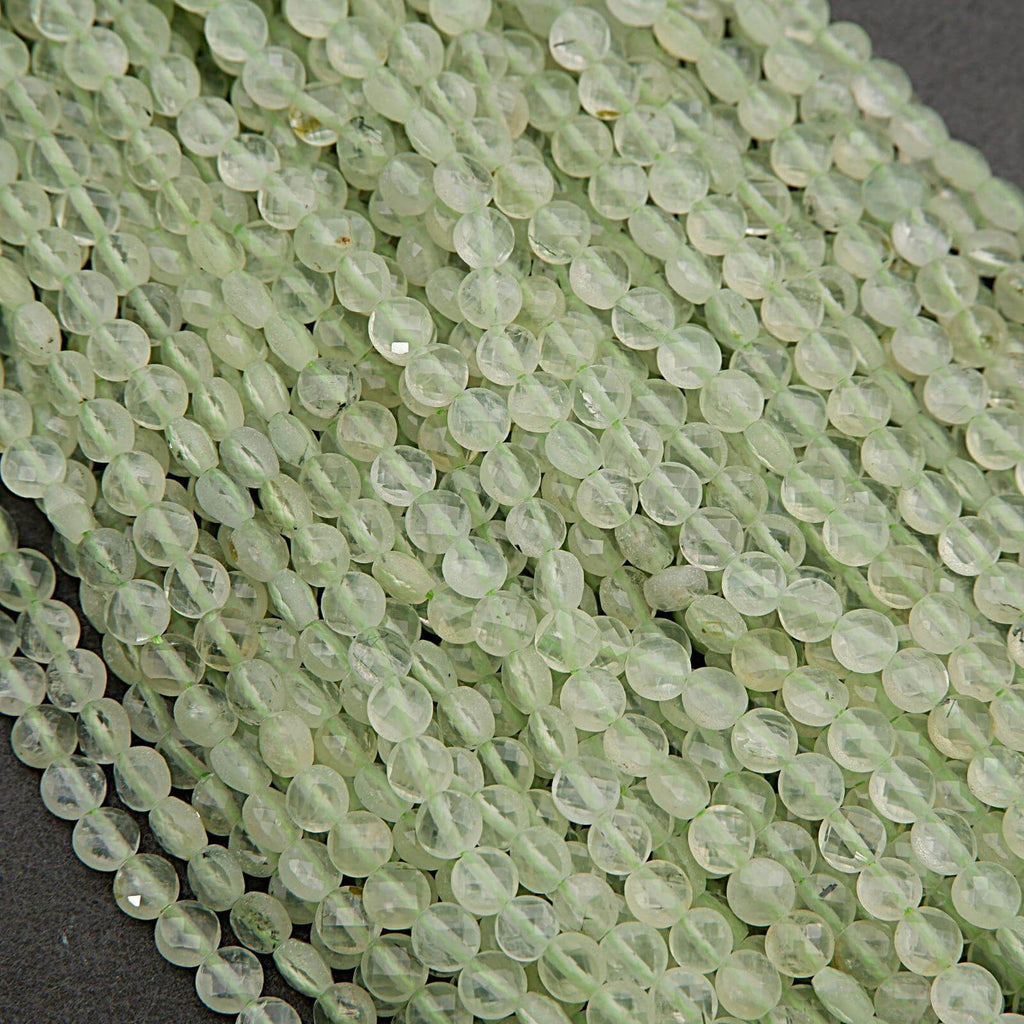 Close-up of light green beads on a dark background