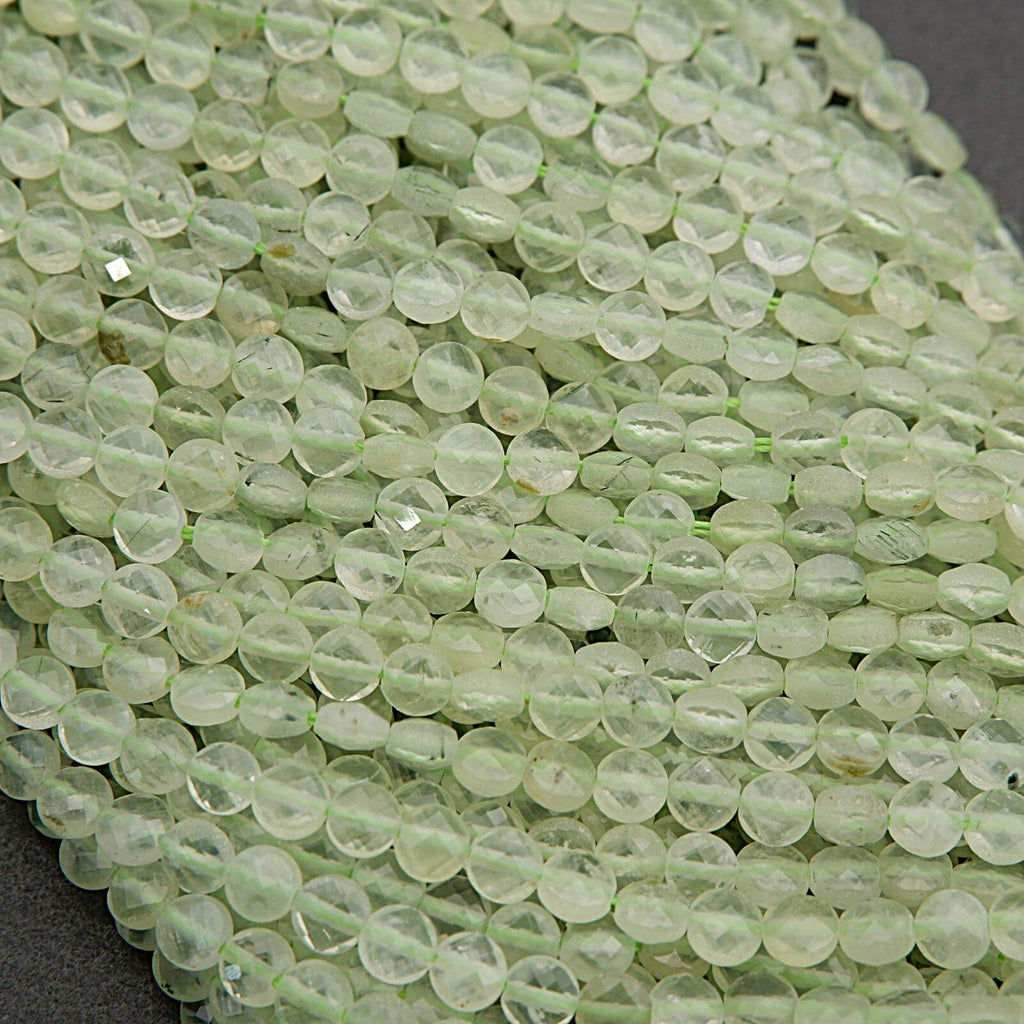 Close-up of green glass beads on a dark background
