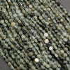Close-up of green and white beaded necklace on a gray background