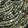 Close-up of green faceted beads