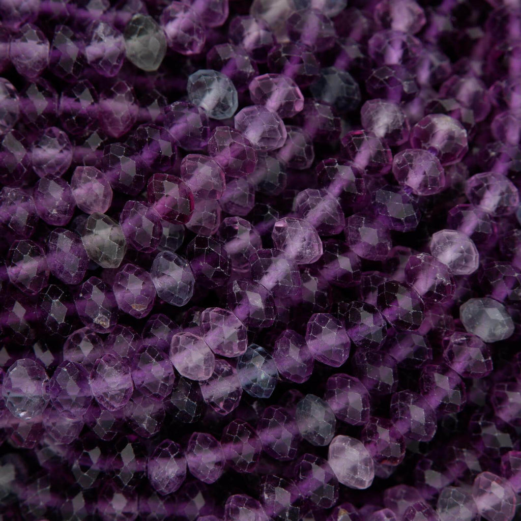 Close-up of purple beads on a dark background