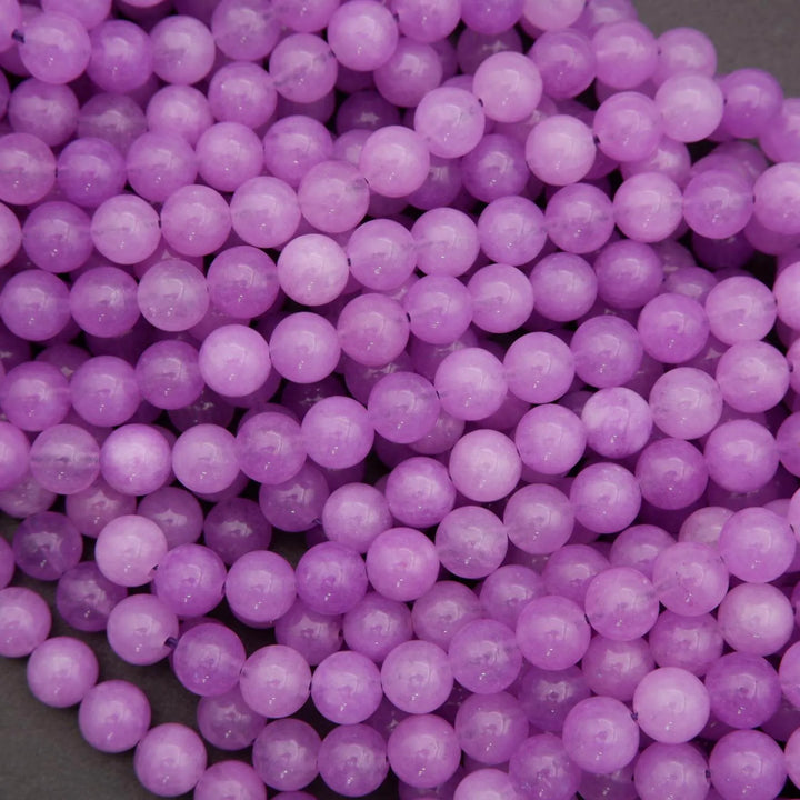 Close-up of purple beads on a gray background