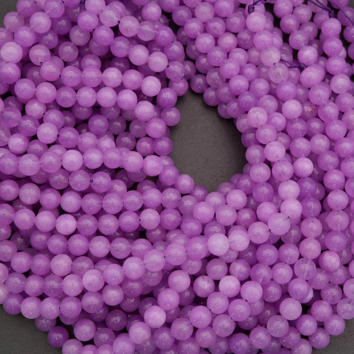 Close-up of purple beads on a dark background