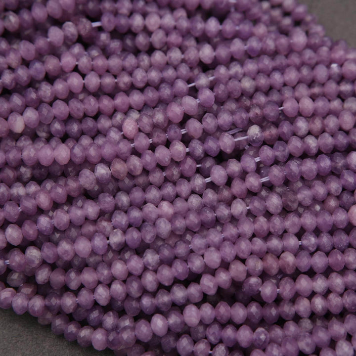 Close-up of purple beads on a gray background