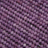 Close-up of purple beads on a string