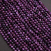Close-up of purple beads on a dark background