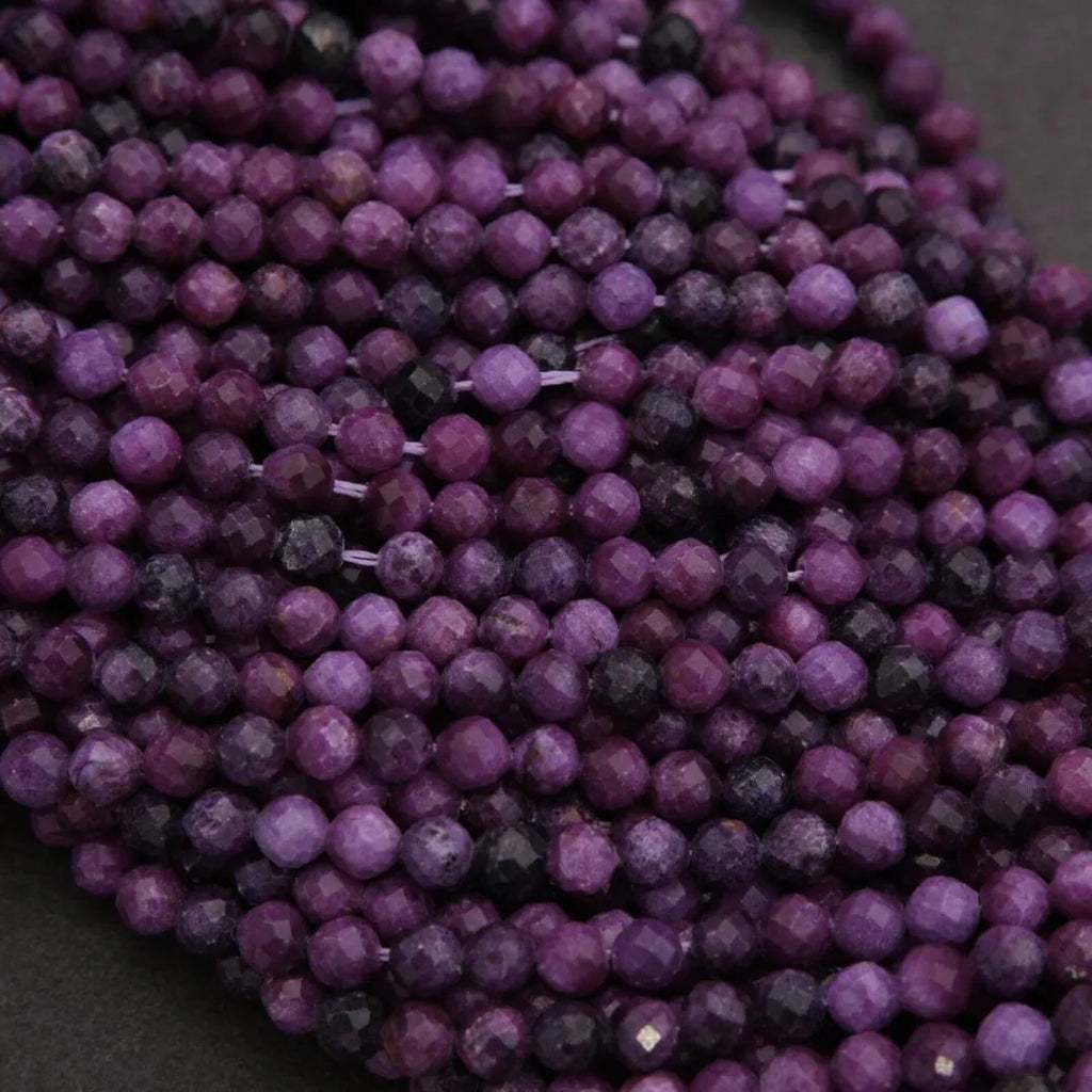 Close-up of purple beads on a dark background