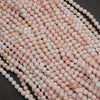 Light pink faceted round beads.