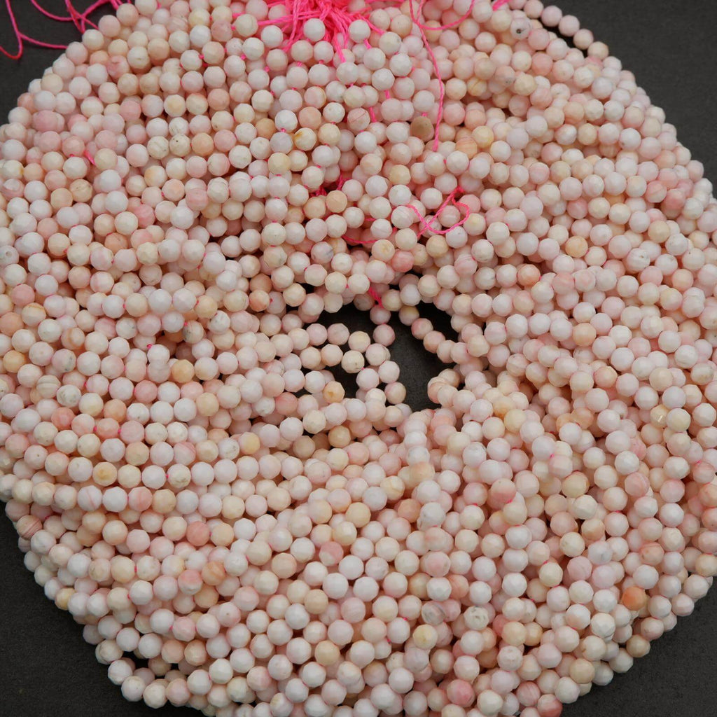Light pink faceted round beads.