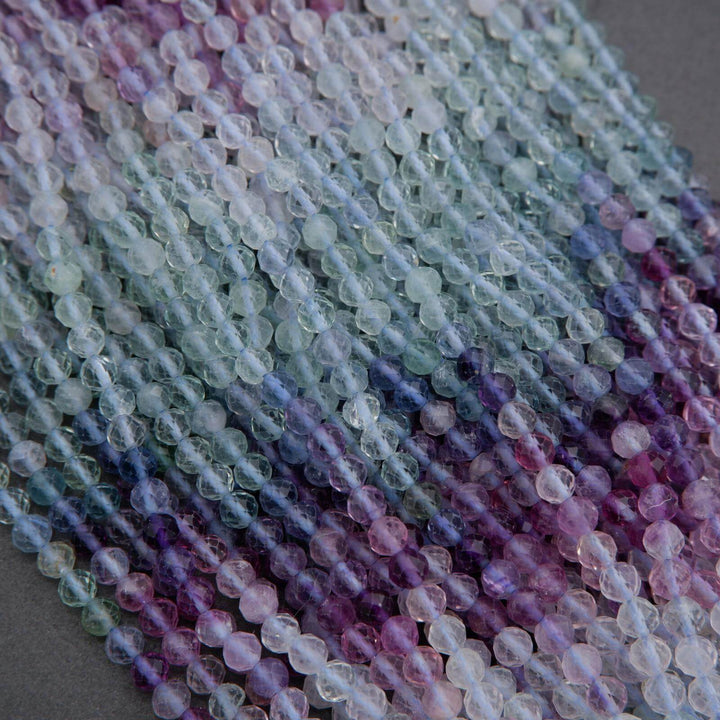 Close-up of multicolored beads on a gray surface
