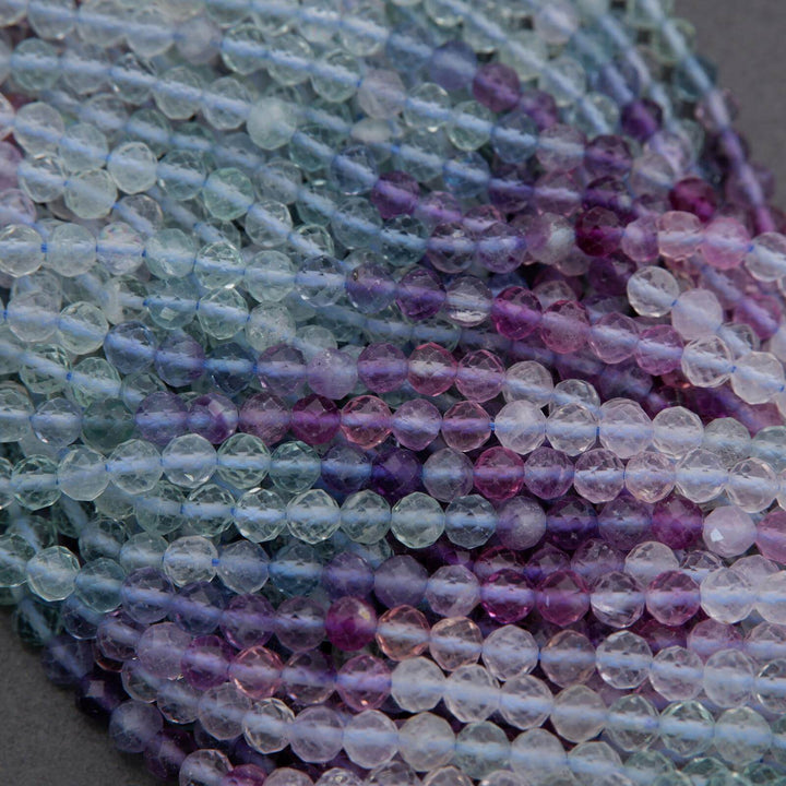 Close-up of multicolored beads on a gray background