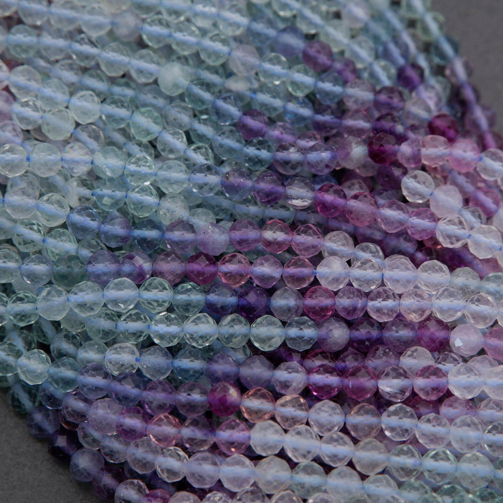 Close-up of multicolored beads on a gray background