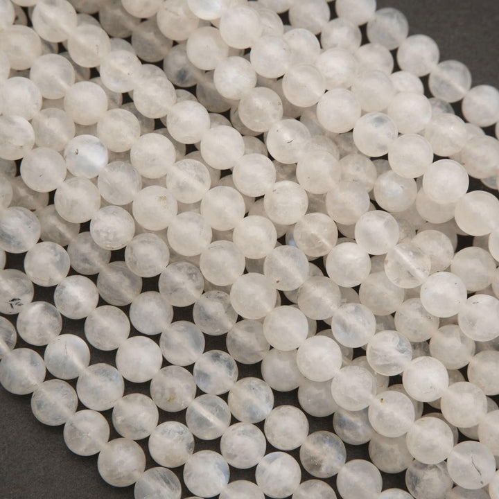 Close-up of white beads on a dark background