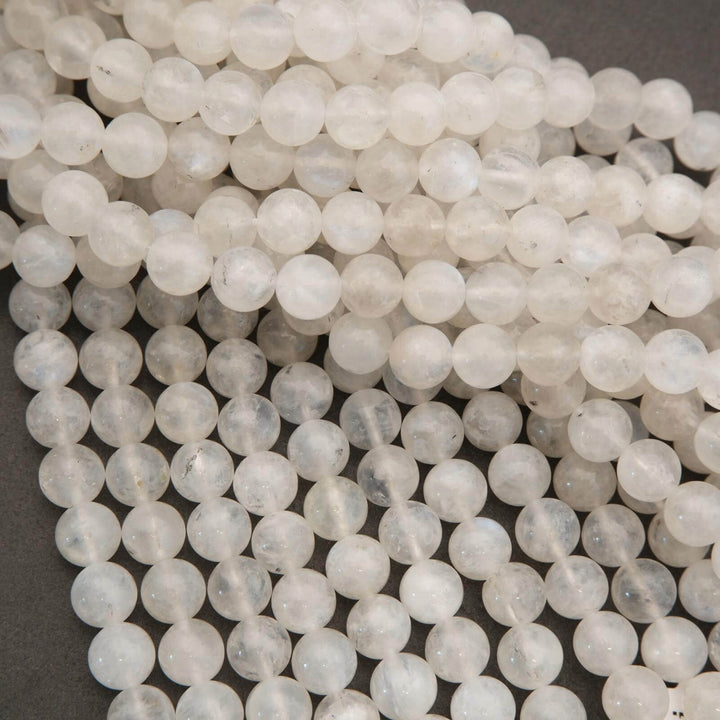 Close-up of white beads on a dark background