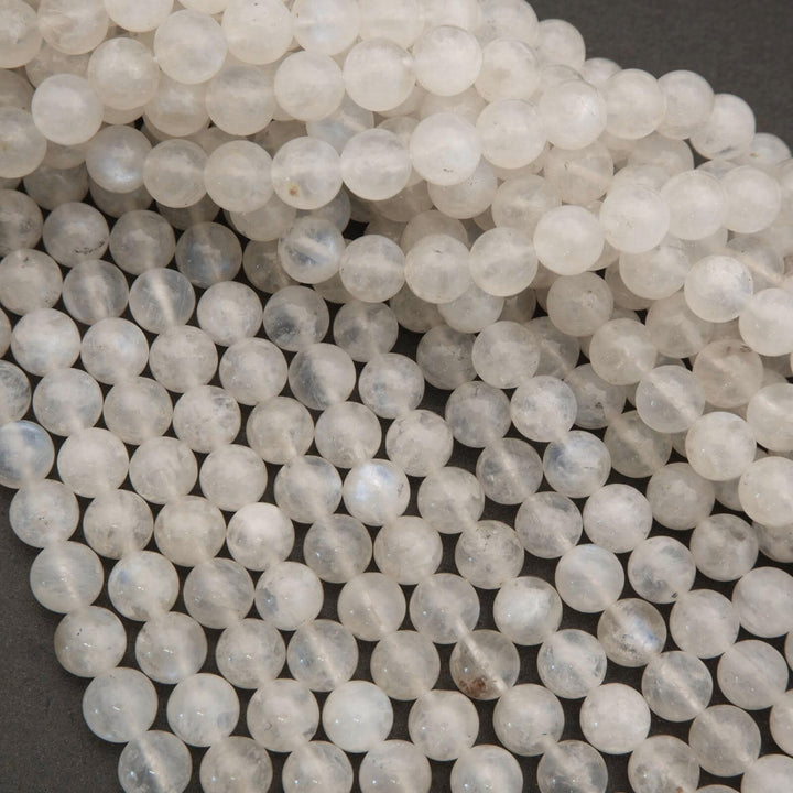 Close-up of white beads on a dark background