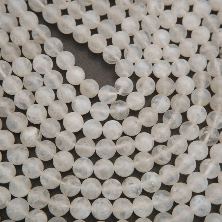 Close-up of white beads on a dark background