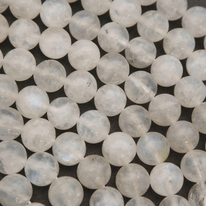 Close-up of white beads on a dark background