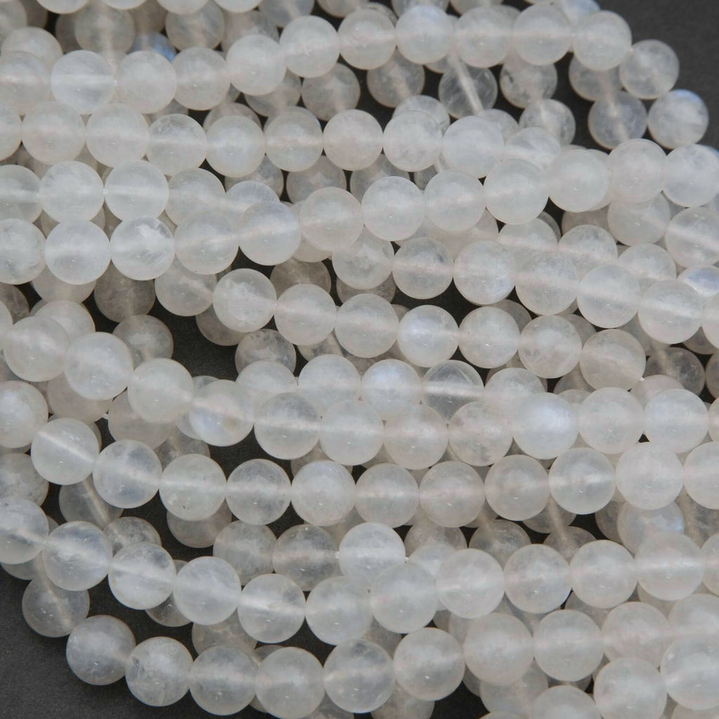 Close-up of white beads on a dark background