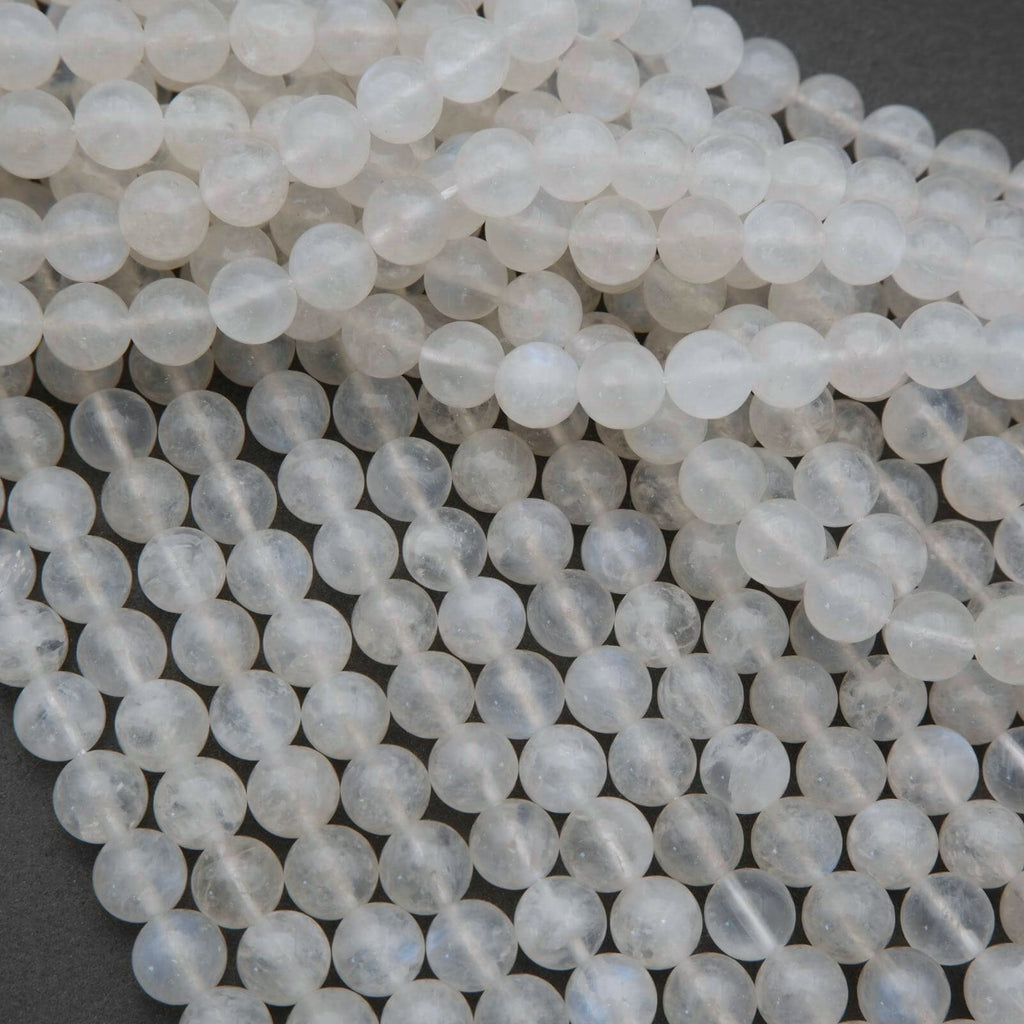 Close-up of white beads on a dark background