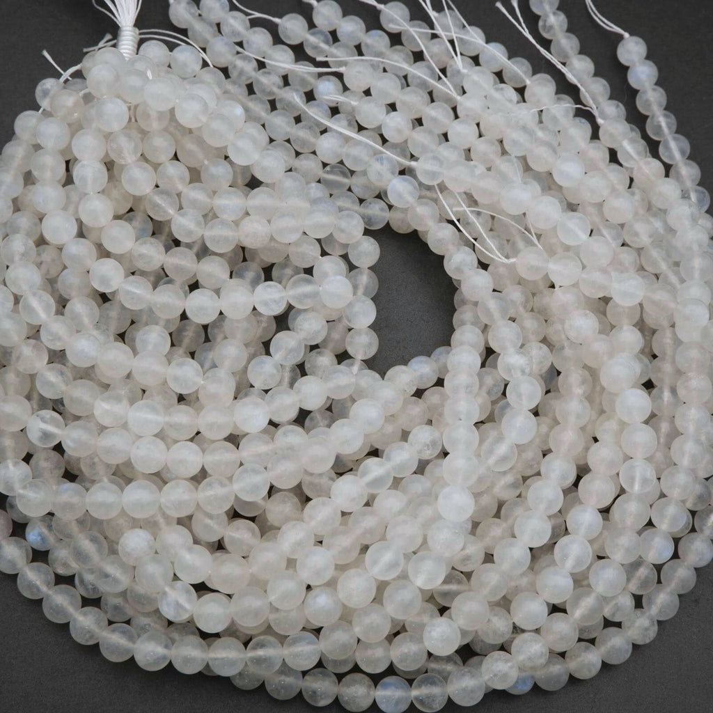 String of white beads on a dark background