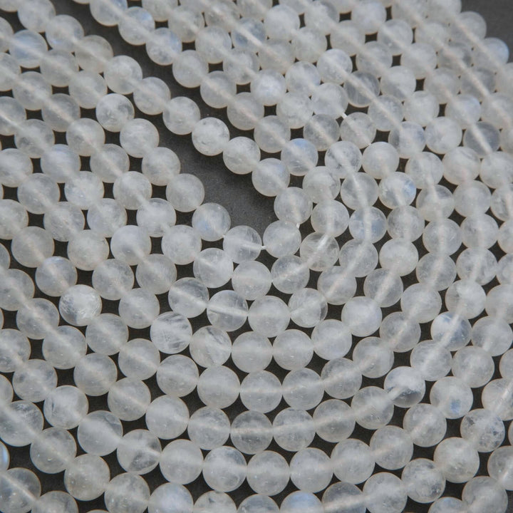 Close-up of clear glass beads on a dark background