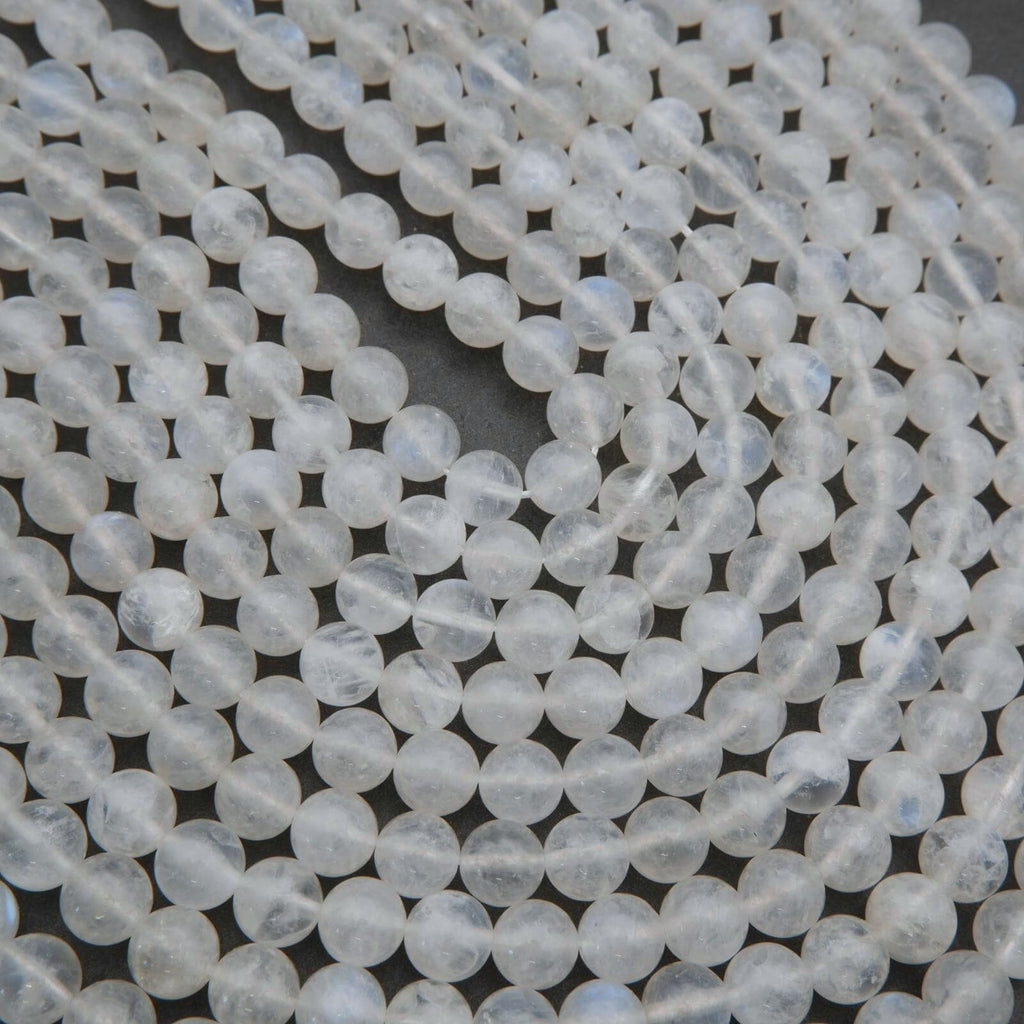 Close-up of clear glass beads on a dark background