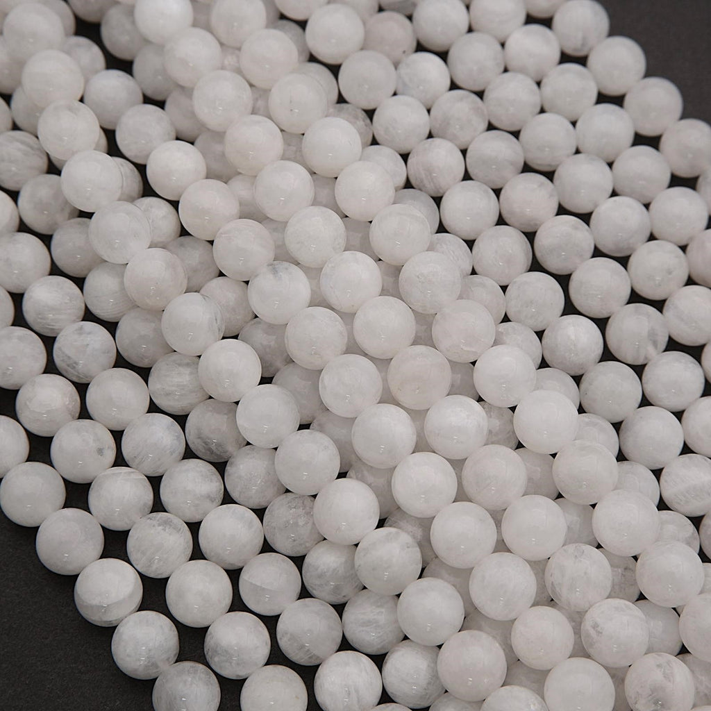 Close-up of white spherical beads on a dark background