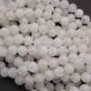 Close-up of white spherical beads on a dark background