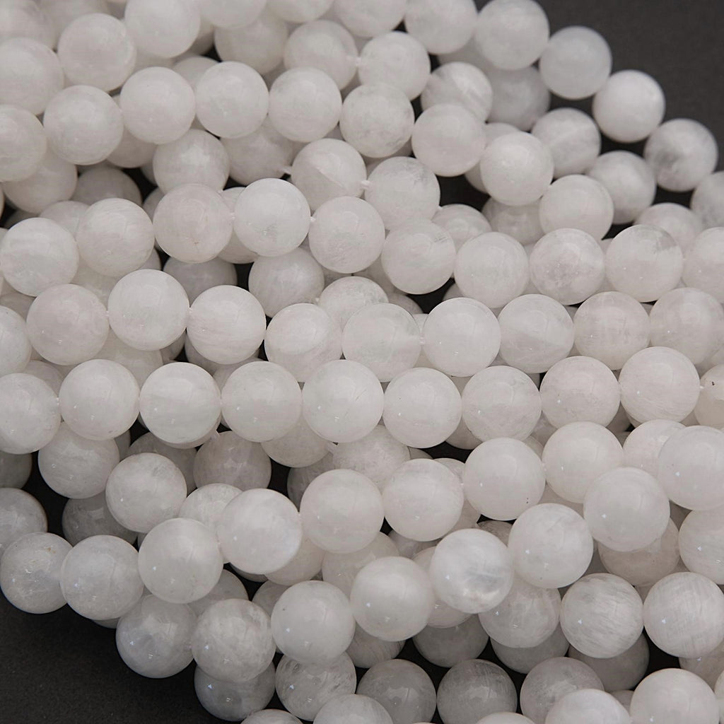 Close-up of white spherical beads on a dark background