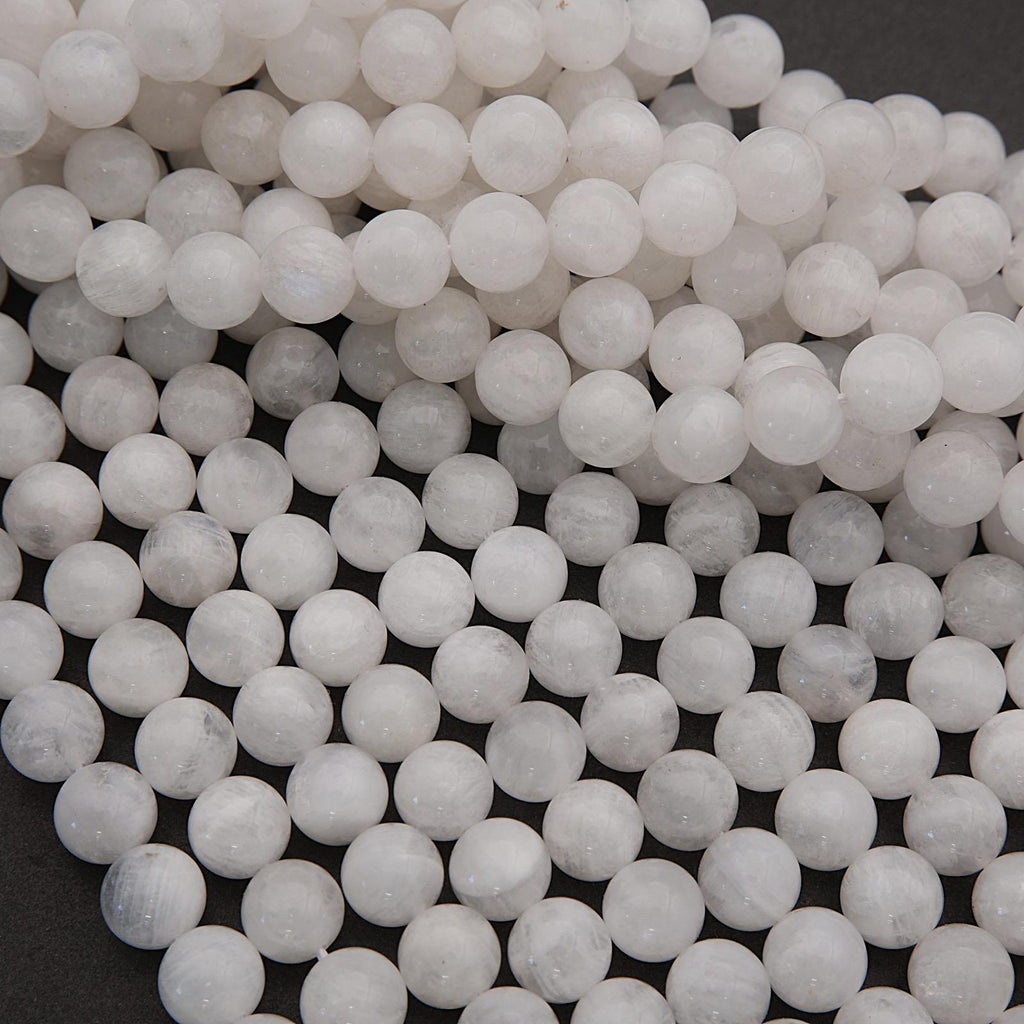 Close-up of white spherical beads on a dark background