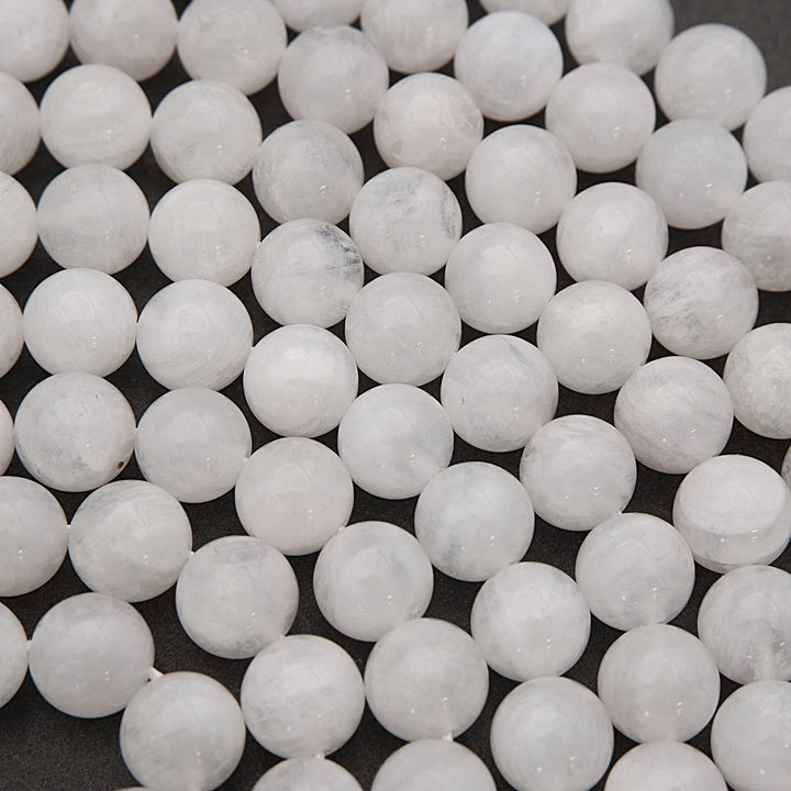 Close-up of white spherical beads on a dark background