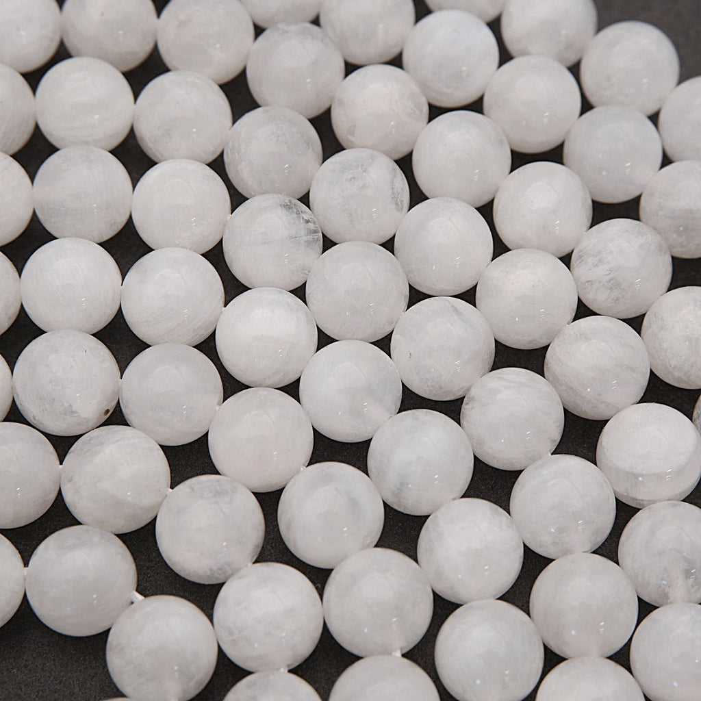Close-up of white spherical beads on a dark background