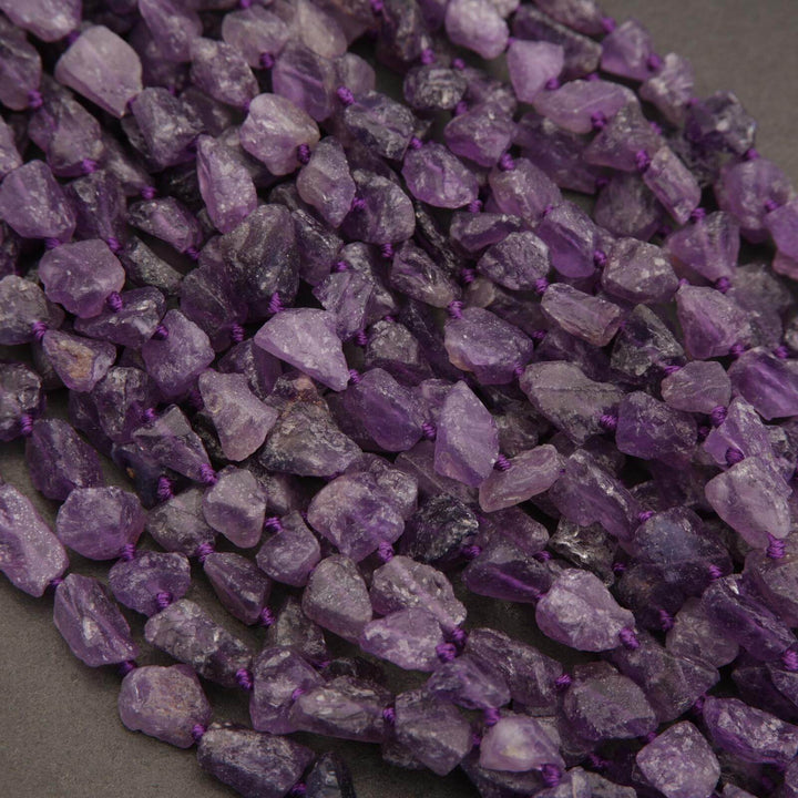 Close-up of purple amethyst gemstones on a dark background