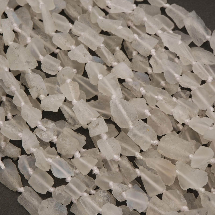 Close-up of translucent stone beads on a dark background