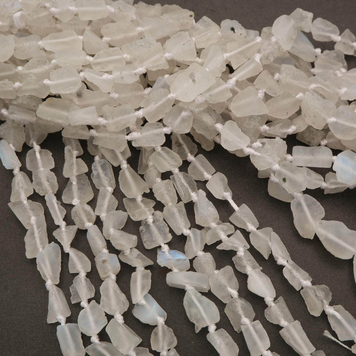 Close-up of white crystal beads on a dark background