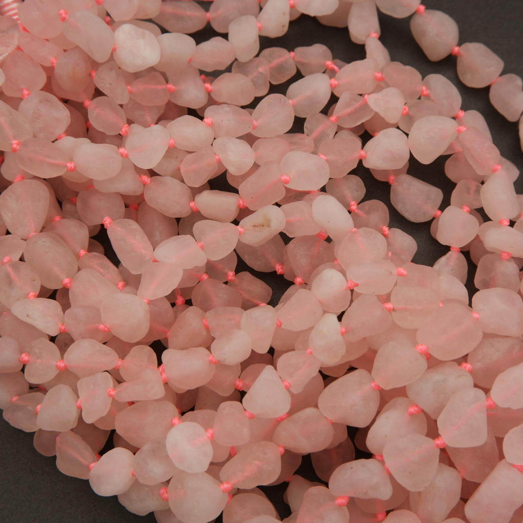 Close-up of pink beads on a dark background