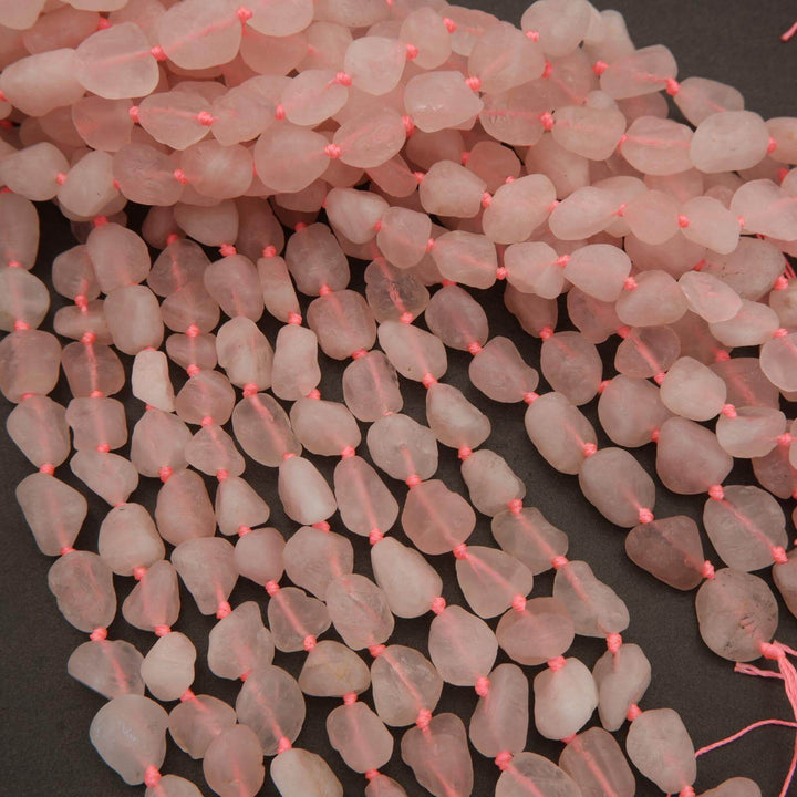 Necklace with pink beads on a dark background