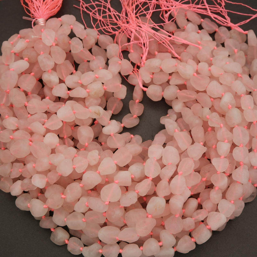 String of pink beads on a dark background