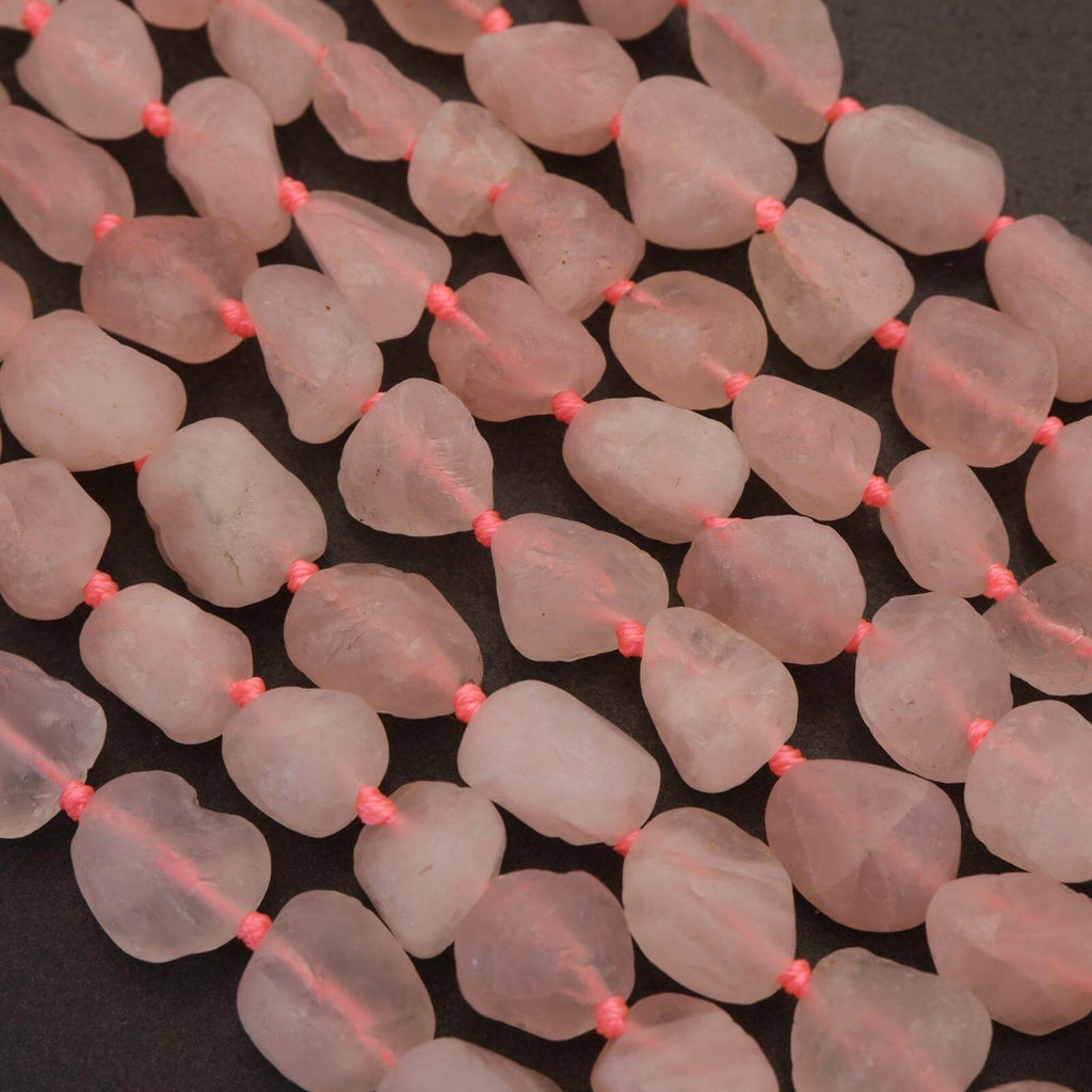 Close-up of pink beads on a dark background