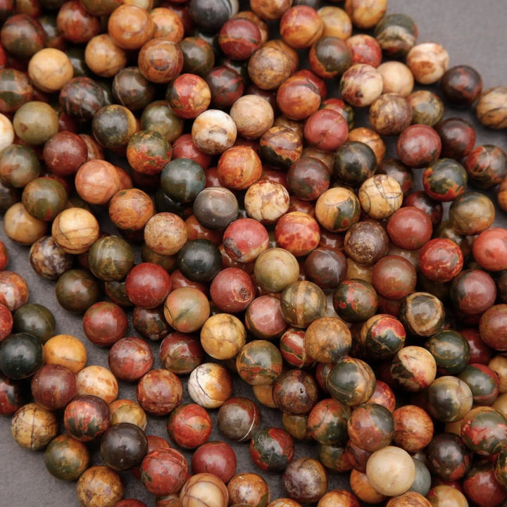 Close-up of multicolored marbled beads on a gray background