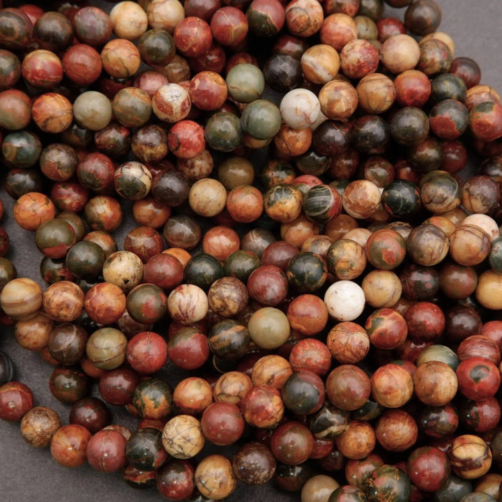 Close-up of multicolored marbled beads on a dark background