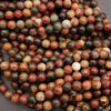 Close-up of multicolored marbled beads on a dark background